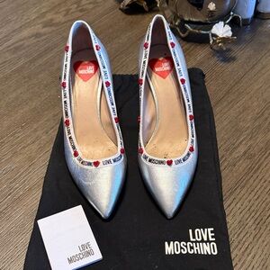 Love Moschino Metallic Silver Pointed Toe Pumps with Heart Trim
